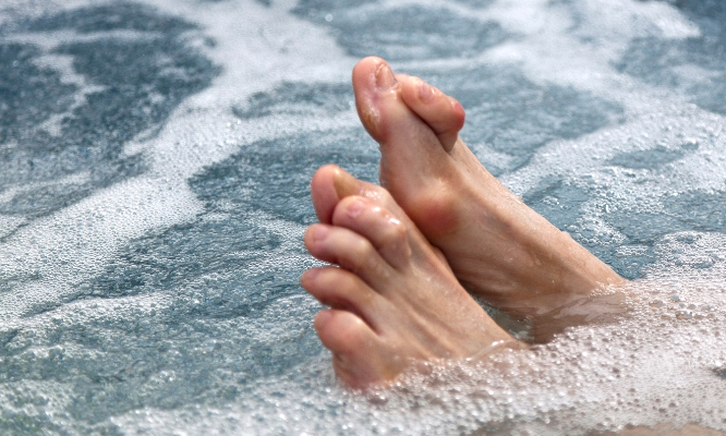 The causes of hammertoes. Someone's feet who is suffering with hammertoes. 