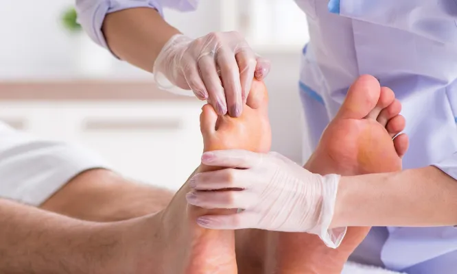 doctor examining patient's legs