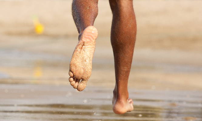 bosses feet on the beach